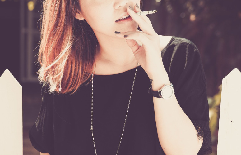 young woman smoking a cigarette