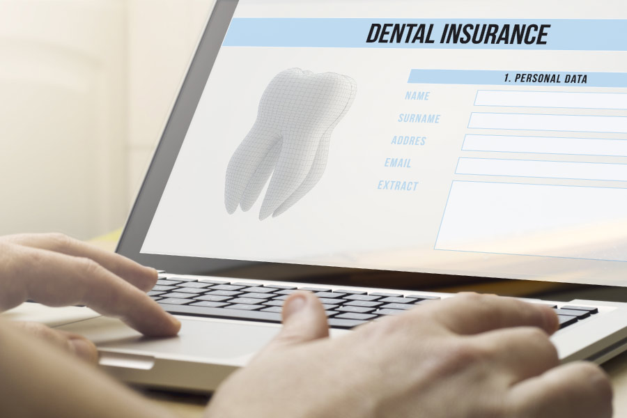 researching dental insurance on a computer screen